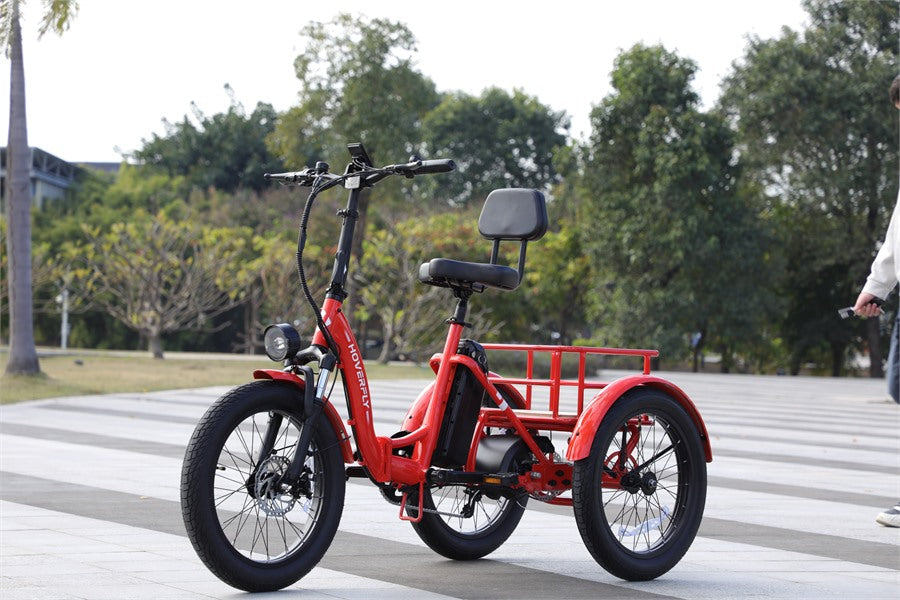 Hoverfly ET1 folding electric trike with low step-through frame, rear cargo basket, and 400 lb payload capacity for heavier riders